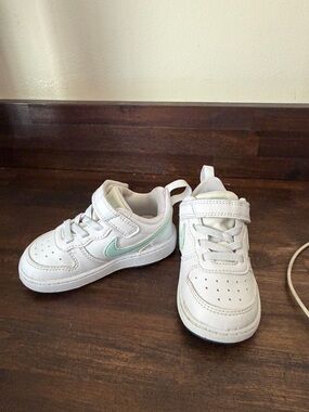 Nike Kids White Sneakers with Mint Swoosh Accent